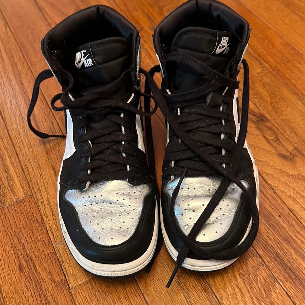 Air Jordan black, white and silver high top sneakers